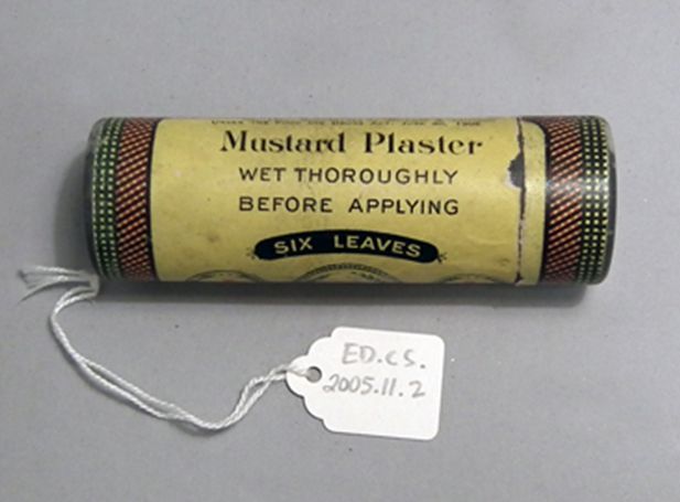 This mustard plaster tin from the early 20th century was manufactured by Johnson & Johnson. Mustard plaster is a poultice of mustard seed powder spread inside a cloth dressing. It is applied to the chest or abdomen to help stimulate healing.