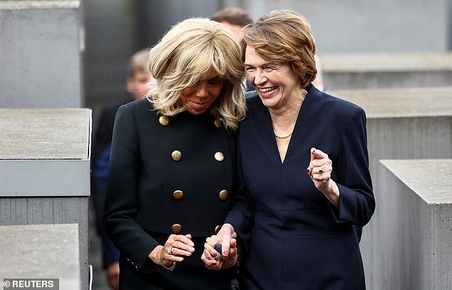 🇩🇪🇫🇷 France's First 'Lady,' Brigitte Macron, and the wife of Germany's president share a laugh after a wreath-laying ceremony at the Holocaust memorial in Berlin.