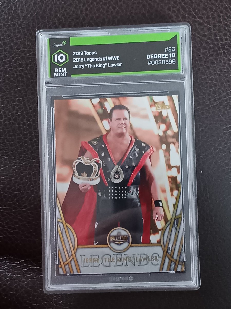 ewing_michael77's tweet photo. What's your favorite card in your collection? I wanna see!

Here's mine. Grew up on Memphis wrestling &amp; this my dude. This card is from Lawler's lone 'Mania match &amp; he's wearing his old school entrance gear. The card itself is gorgeous &amp; made even better by grading a gem mint 10. https://t.co/GINBTDb46U