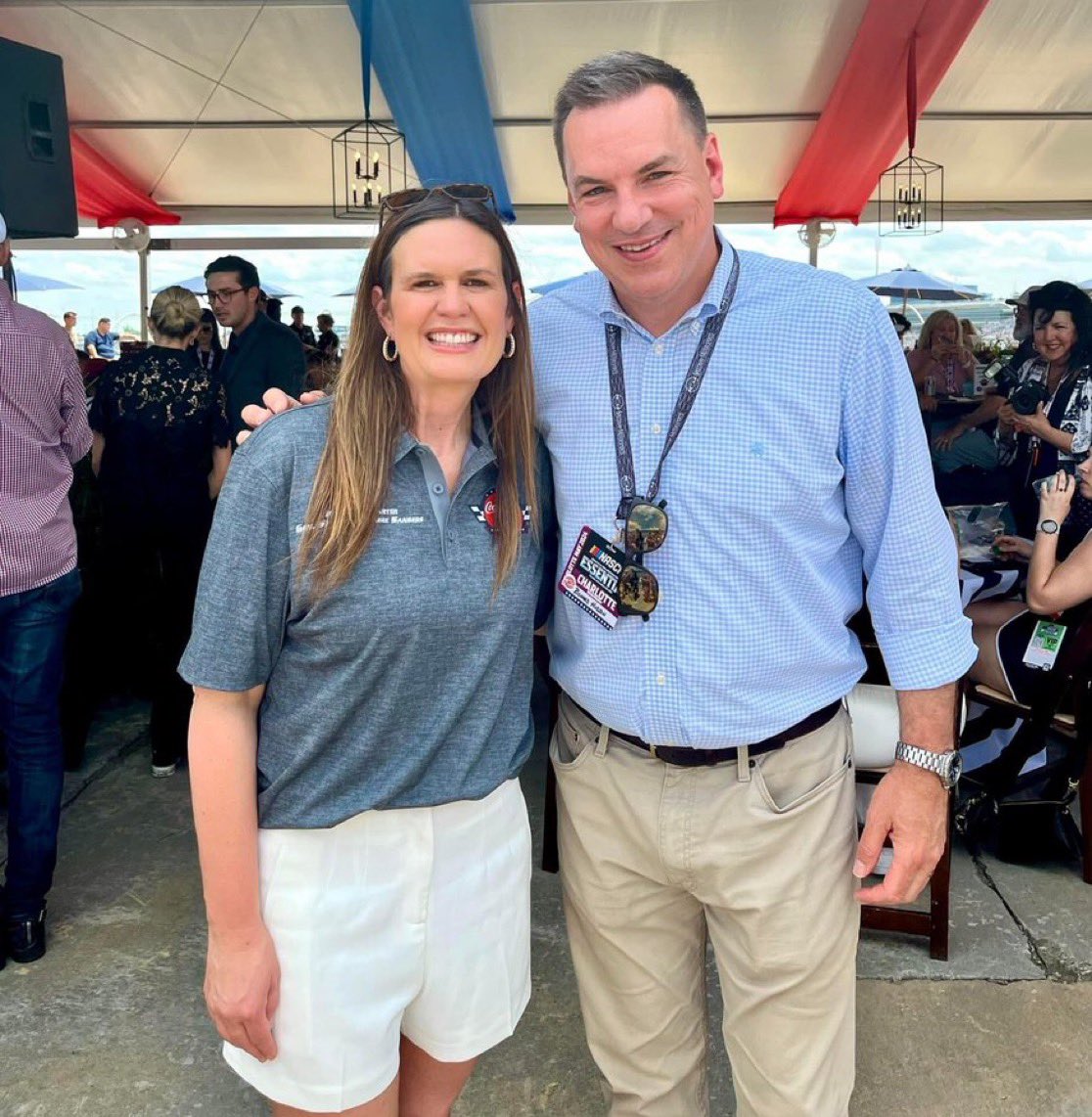 A story of two governors dealing with the immediate aftermath of deaths and destruction from massive storms hitting their states: L - Andy Beshear in Kentucky R - Sarah Huckabee Sanders at the NASCAR race in NC.