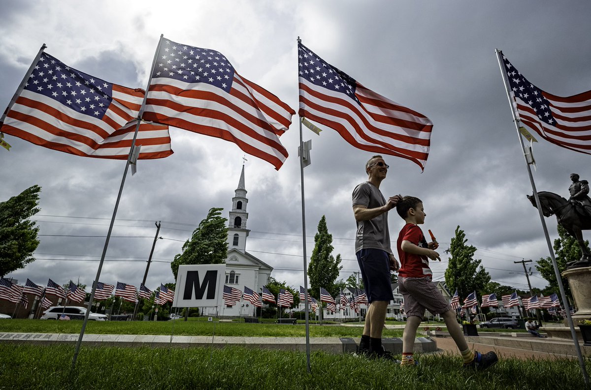 Milford’s Draper Memorial Park Field of Flags is viewed by residents Jamie Keefe and his son Jackson, today. Our Memorial Day coverage-> nbcboston.com/news/local/num… 📸⁦<a href="/pictureboston/">Mark Garfinkel</a>⁩