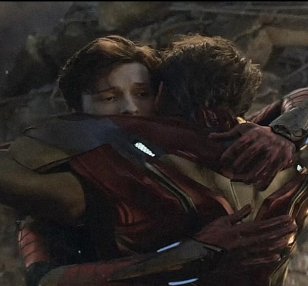 girlypop reenactment of the Ironman and spiderman hug