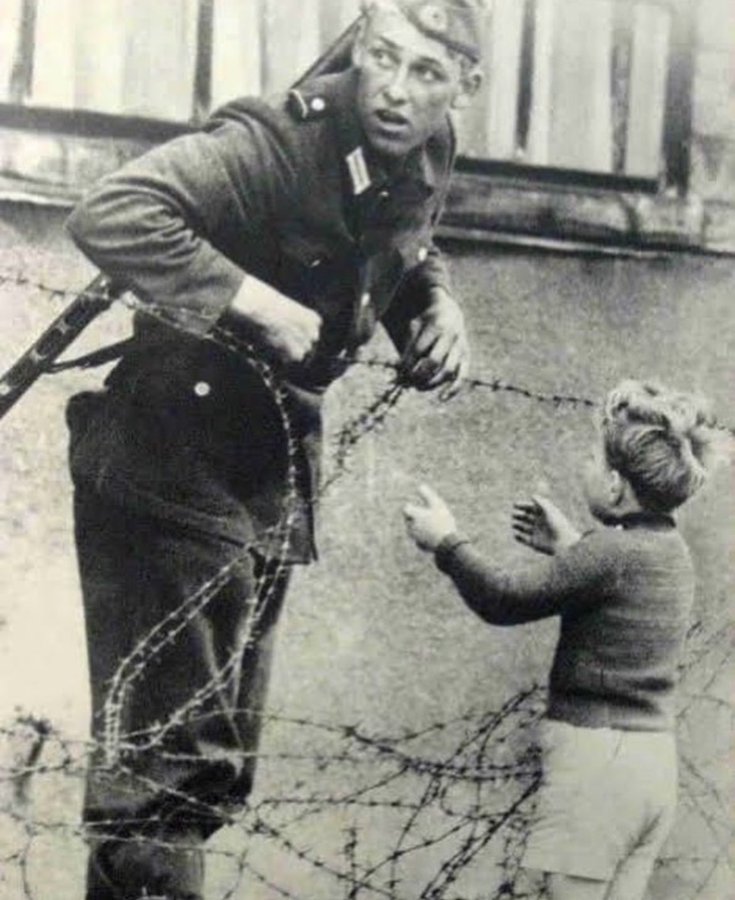 On the day the Berlin Wall was erected in 1961, a young East German soldier defied orders from his government, which prohibited anyone from passing into East Berlin.   

His act of compassion came as a little boy had been left behind in the chaos of people desperately trying to