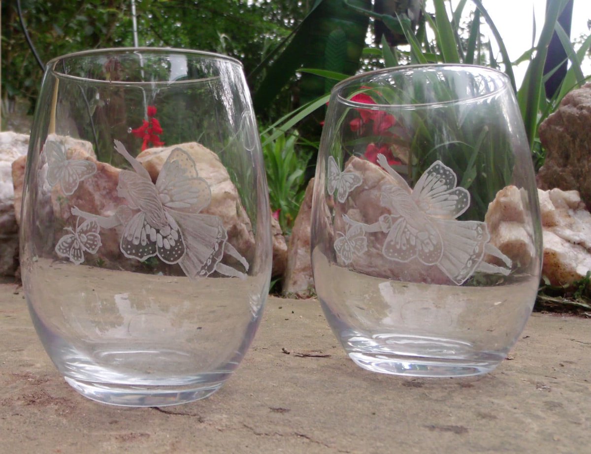 Fairy and butterfly stemless wine glass set of two clear stemless wine glasses clearglasses hand engraved tuppu.net/4931f6eb #wedding #fantasyart #glassart #tattooglass #love #bridal #yearofthedragon #skulls #dragoncore #FairyGlassware