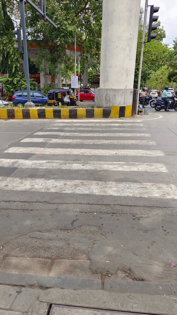 BMC you had one job to do! Do you think humans are kangaroos who can jump over the medians/metro pillars? Freshly painted zebra crossing just before PM Modi's Roadshow on LBS Road, outside Godrej, Vikhroli. How did these guys get their jobs in the first place?