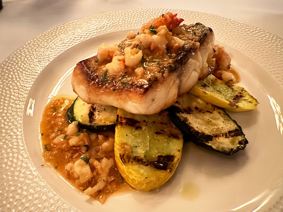 Just look @ our fabulous new fish special — pan-seared wild striped bass with grilled zucchini, squash & eggplant, topped with chopped shrimp & a buttery shrimp sauce. It’s *delicious *. Bon appetit! #mannysbistro #fish #bonappetit #wildstripedbass #newyork #pescatarian #nyc