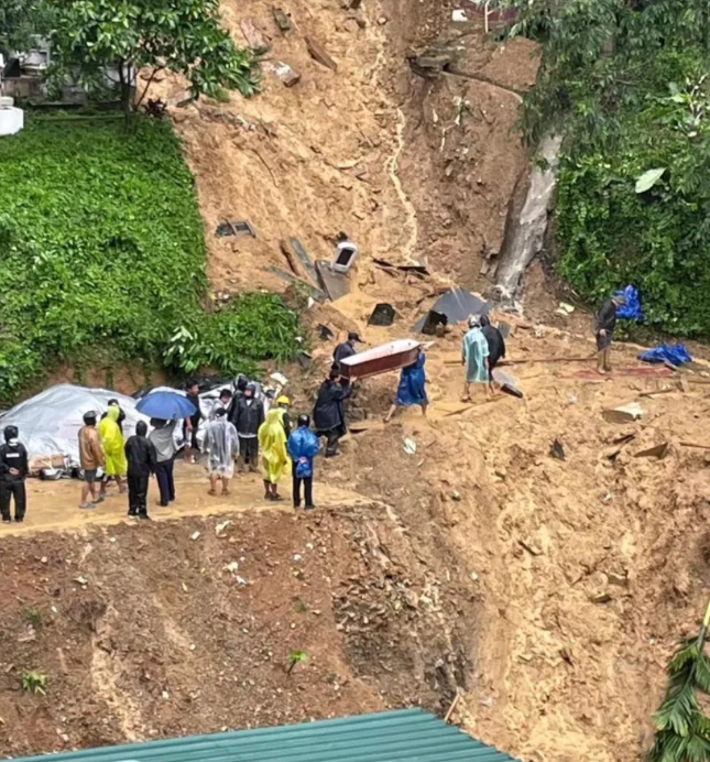 After Cyclone Remal struck Aizawl, India, a landslide hit a graveyard in the Kanan locality, unearthing coffins and causing grave monuments to slide down the hillside. Volunteers and the Young Mizo Association are working to recover bodies and clear blockades. In the ITI