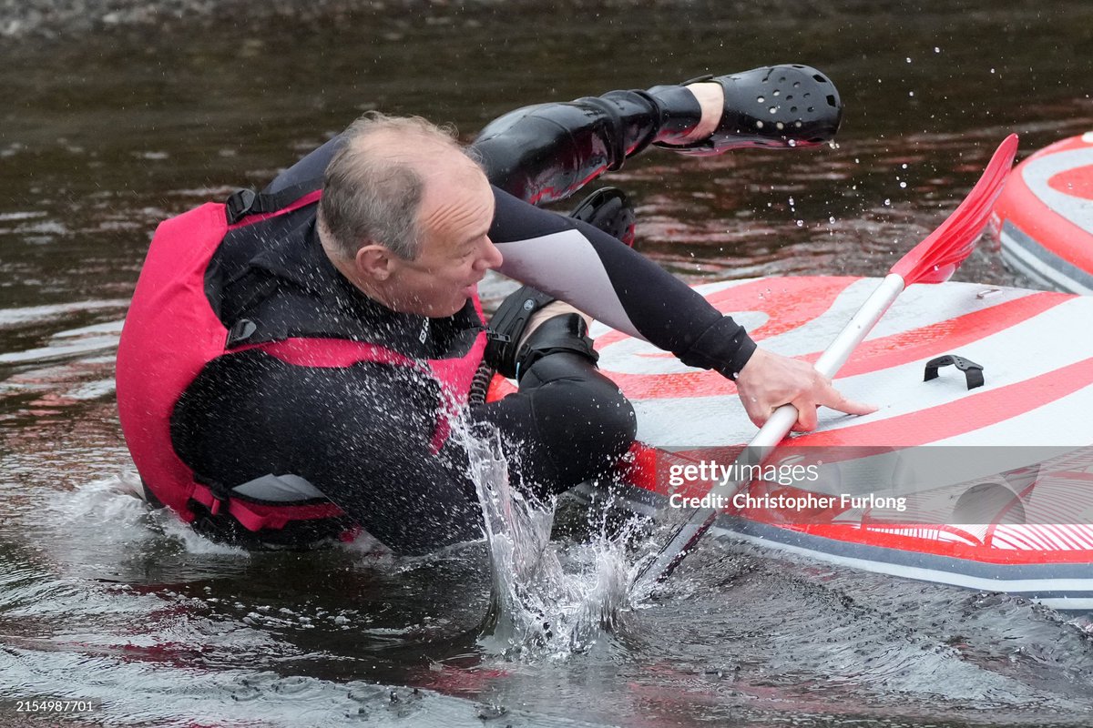 Liberal Democrats Leader Ed Davey (L) enjoys some paddle boarding on Lake Windermere during a campaign visit, with Tim Farron, MP for Westmorland and Lonsdale in Windermere, England. The UK general election will be held July 4th (2024)