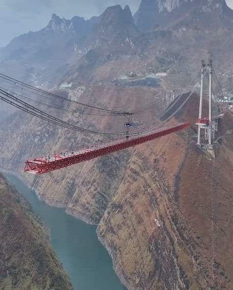 This suspension bridge construction in China is a textbook example of civil engineering.