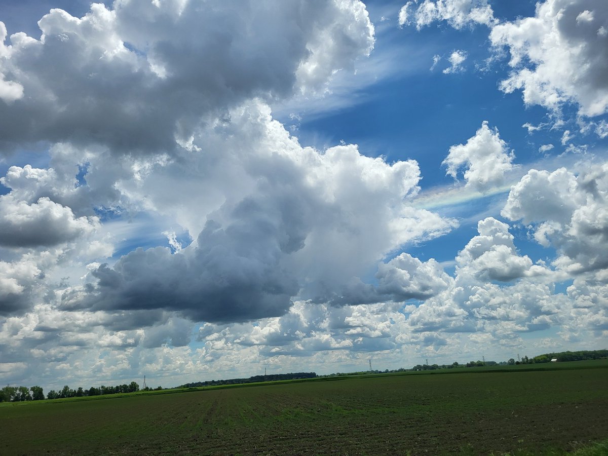 Nice cloud iridescence and towering cumulus in Michigan today! @spann