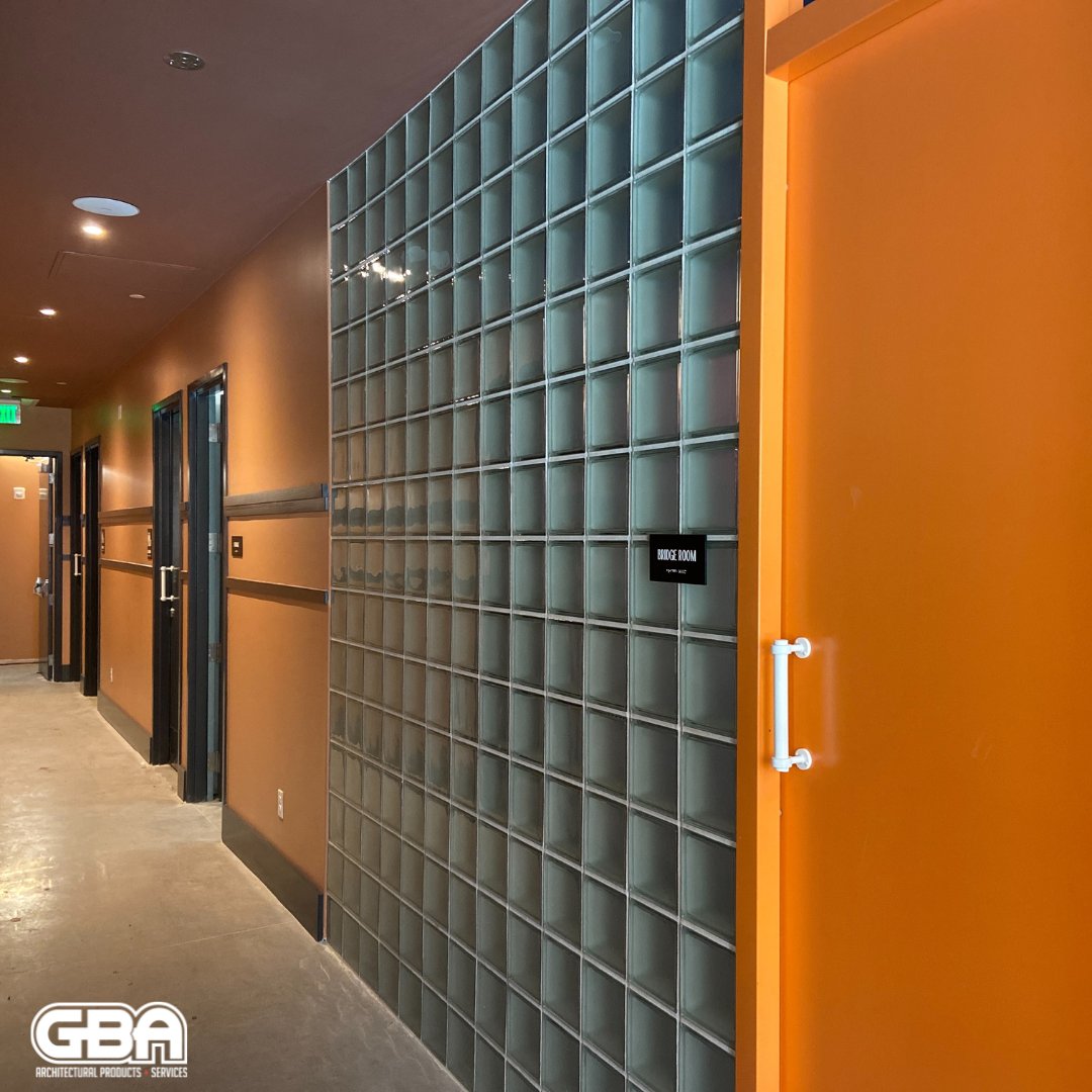 GBA installed two types of glass block at Common House, enhancing its aesthetic appeal and creating a dynamic environment for all who visit. Originally built in the 1840s, 420 Julia Street has a rich history, now housing a modern social club fostering connections among members.