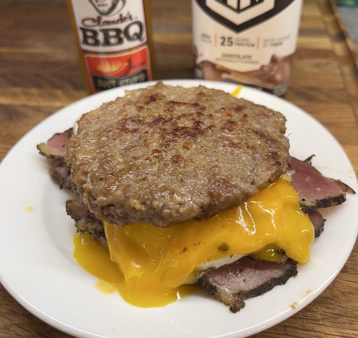 Leg day refuel- sausage patty, pastrami, egg, extra sharp cheddar cheese, and sausage patty.