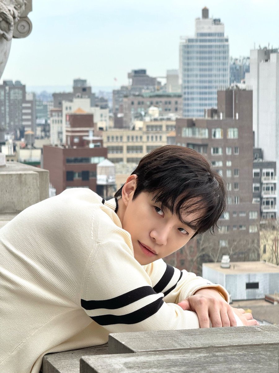 Soaking in the panoramic views of New York City from this rooftop perch, the vibrant energy of the bustling metropolis hums beneath me while I find a moment of tranquility amidst the urban symphony.