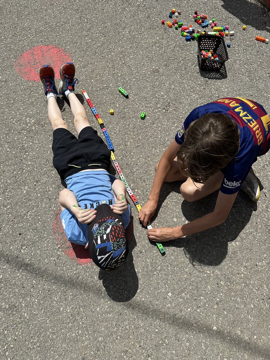 We helped our grade 1 &amp; 2 buddies do some measuring outside, using standard and nonstandard units.  

How many snap cubes tall are you? 
🟥🟦🟩🟨🟪