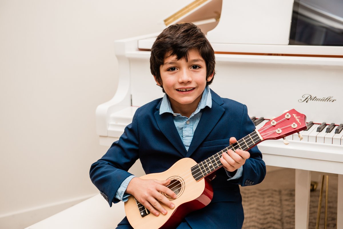 Guitar lessons are a great way to grow your child's confidence and encourage their creativity! 🌟 Angeles Academy has expert instructors ready to guide them #AngelesAcademyofMusic #guitarlessonsforkids