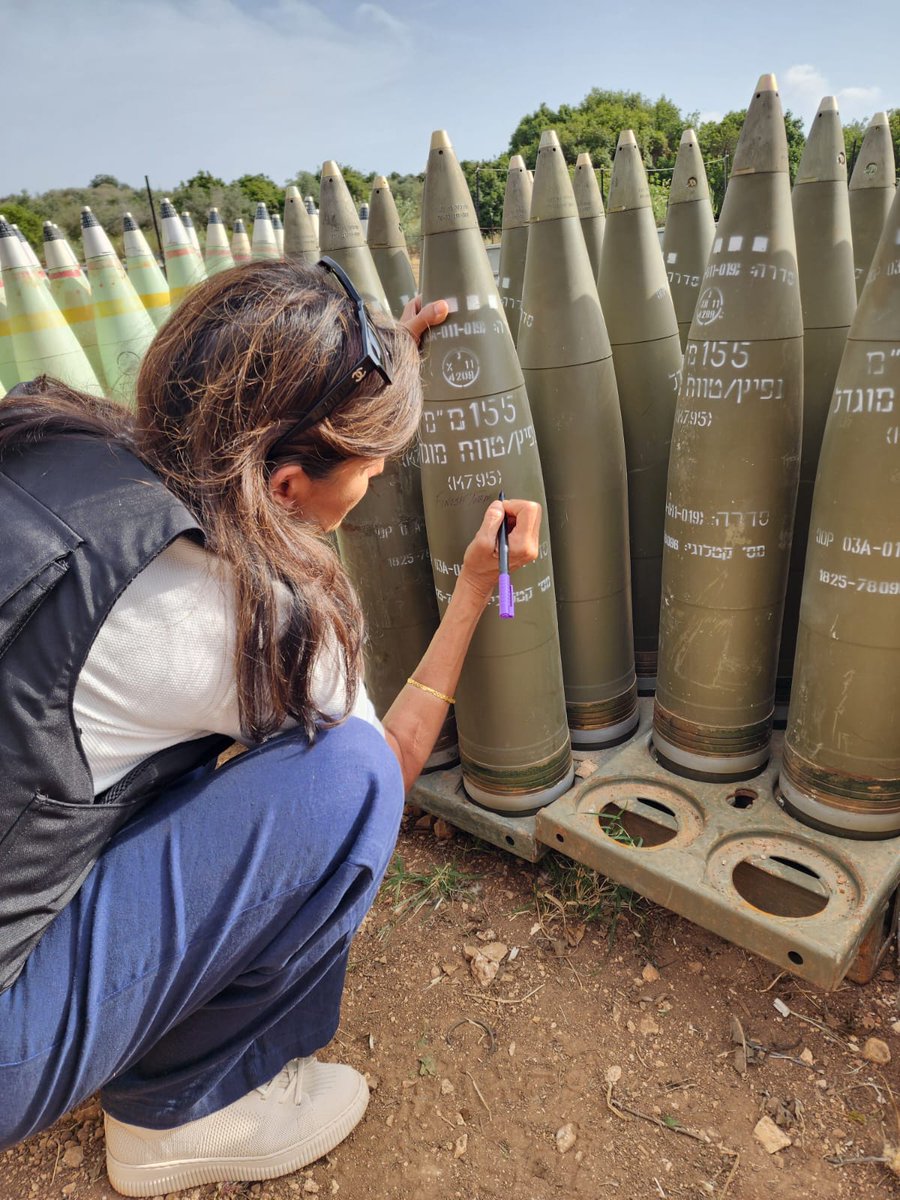 Nikki Hailey in Israel scribbling 'FINISH THEM'on the shells that the IDF is about to fire into Rafah in defiance of the International Court of Justice. Biden provided the shells, Republicans autograph them. The US political class is united in its complicity with this genocide.