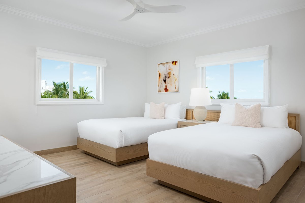Take in the stunning views of Grace Bay Beach from the balcony of your Deluxe 2-bedroom Oceanfront Suite at Alexandra Resort.

With televisions, a washer/dryer and bedroom views, your family vacation will feel like your home away from home. #allinclusive #turksandcaicos