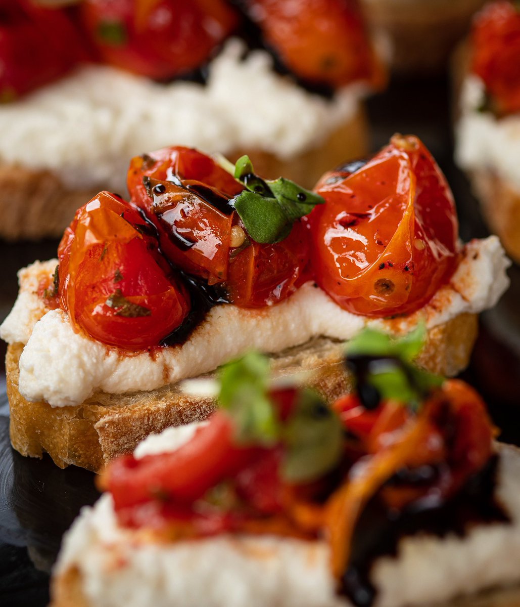 Behold...Bruschette with Roasted Tomatoes, Cow Ricotta, Balsamic and Micro Basil. 🤩