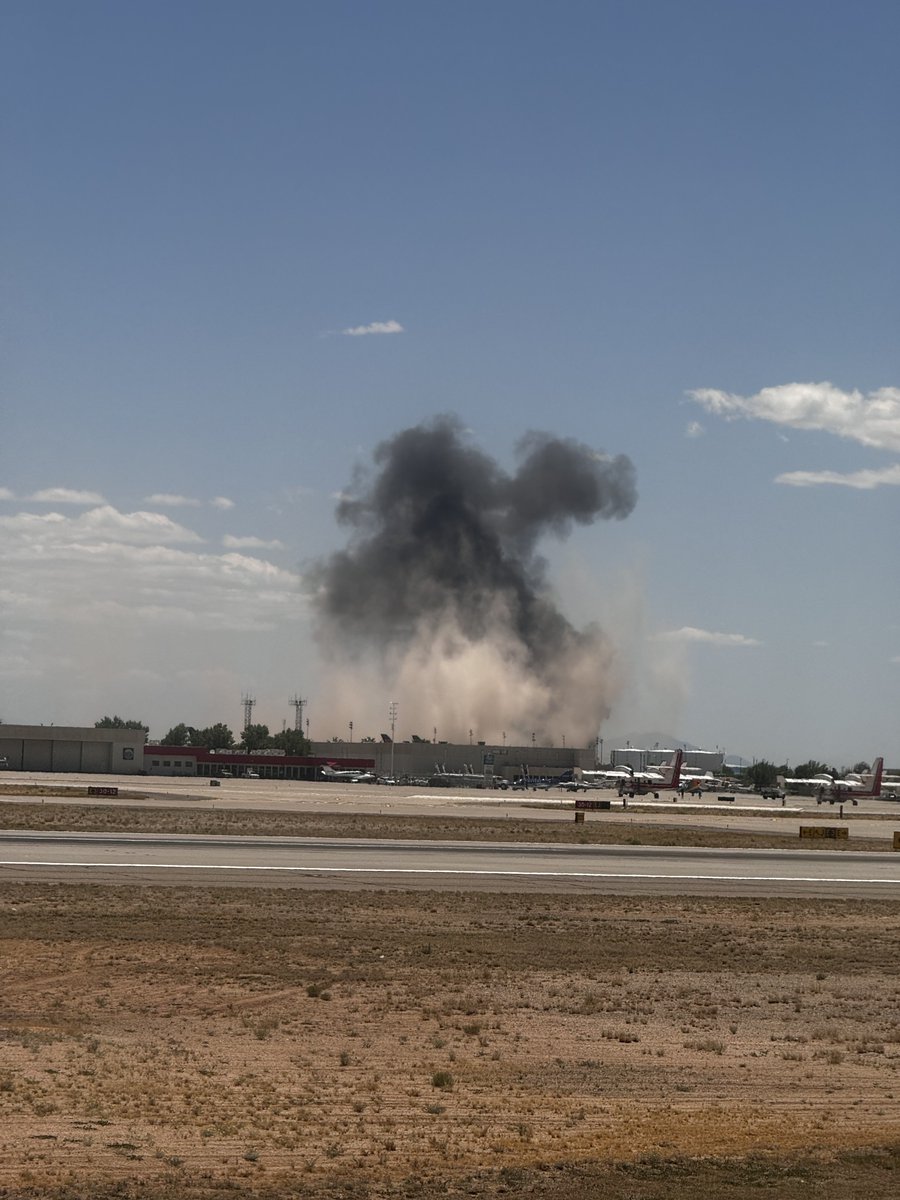 I just witnessed a major, horrific aircraft crash with an explosion and dust rising into the air while I'm on my flight on the runway. I will report on it soon, waiting for more details but the person behind me said it was possible it was a helicopter or some type of single