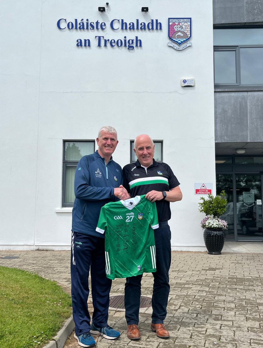 Limerick senior hurling manager John Kiely presents a signed Limerick jersey in appreciation to Padraig Flanagan to mark his retirement as Principal of Castletroy College