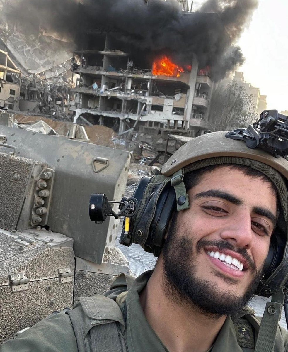 Engineer Nizar Al-Wahidi, the owner of the burning house in this picture, wrote on his facebook account:
'I respect a soldier who stands against another soldier, but for a military man to boast about killing, destroying, and burning civilian targets goes against all principles