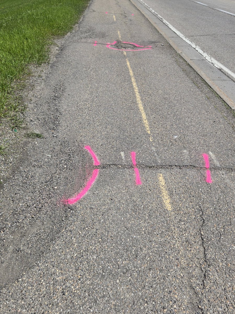 dcsscd's tweet photo. I see the city is again out trying to stitch the cracks on the yyc bike paths. Hopefully, the pink works better than the white did. https://t.co/3QYq1py8Gz