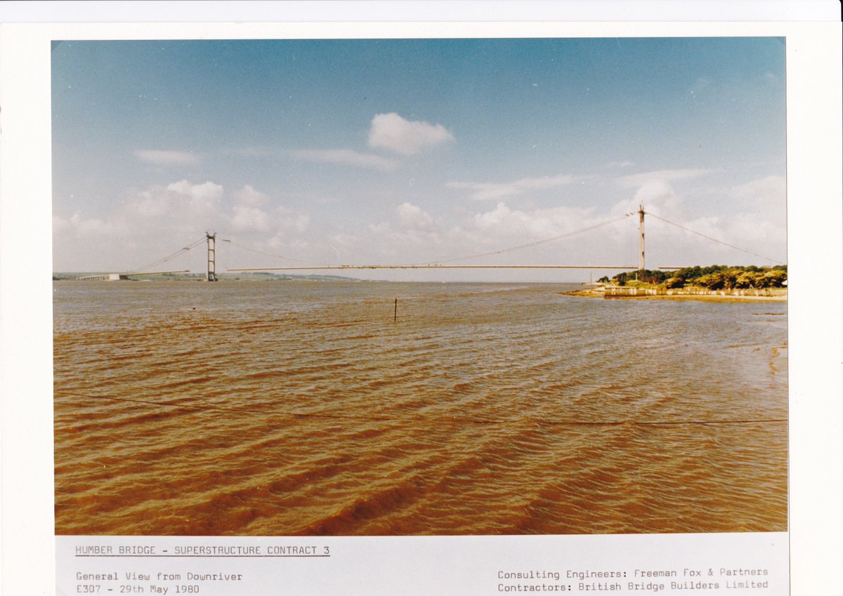 HumBridgeNews's tweet photo. On this day in 1980, the final pieces of the road deck were being put in place - and the iconic outline of our landmark bridge was pretty much complete.

The road section is made up of 124 steel boxes - each one is about 18 metres long and weighs about 140 tonnes – about twice as heavy as The Space Shuttle
 
The boxes were put together at an assembly yard just two miles downstream from where the bridge was being built. If you look east from the bridge, you can see a small jetty in the estuary – that’s where the assembly yard was. Once ready, the sections were then floated down the Humber on barges and lifted and fixed into place.

#humberbridge #engineering