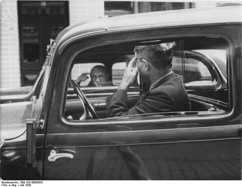 Two Berlin drivers making insulting gestures to each other, 1939.