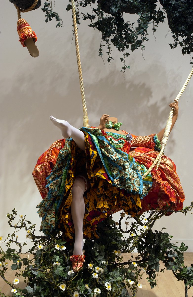 Tate's tweet image. Lately we’re loving escapist, period-costumed fantasy🌼 

#WorkOfTheWeek is Yinka Shonibare's The Swing (after Fragonard). It features a headless mannequin in mid-swing, wearing a lavish 18th century style dress made of bright African print fabric.

🎀 bit.ly/3MjWuzt