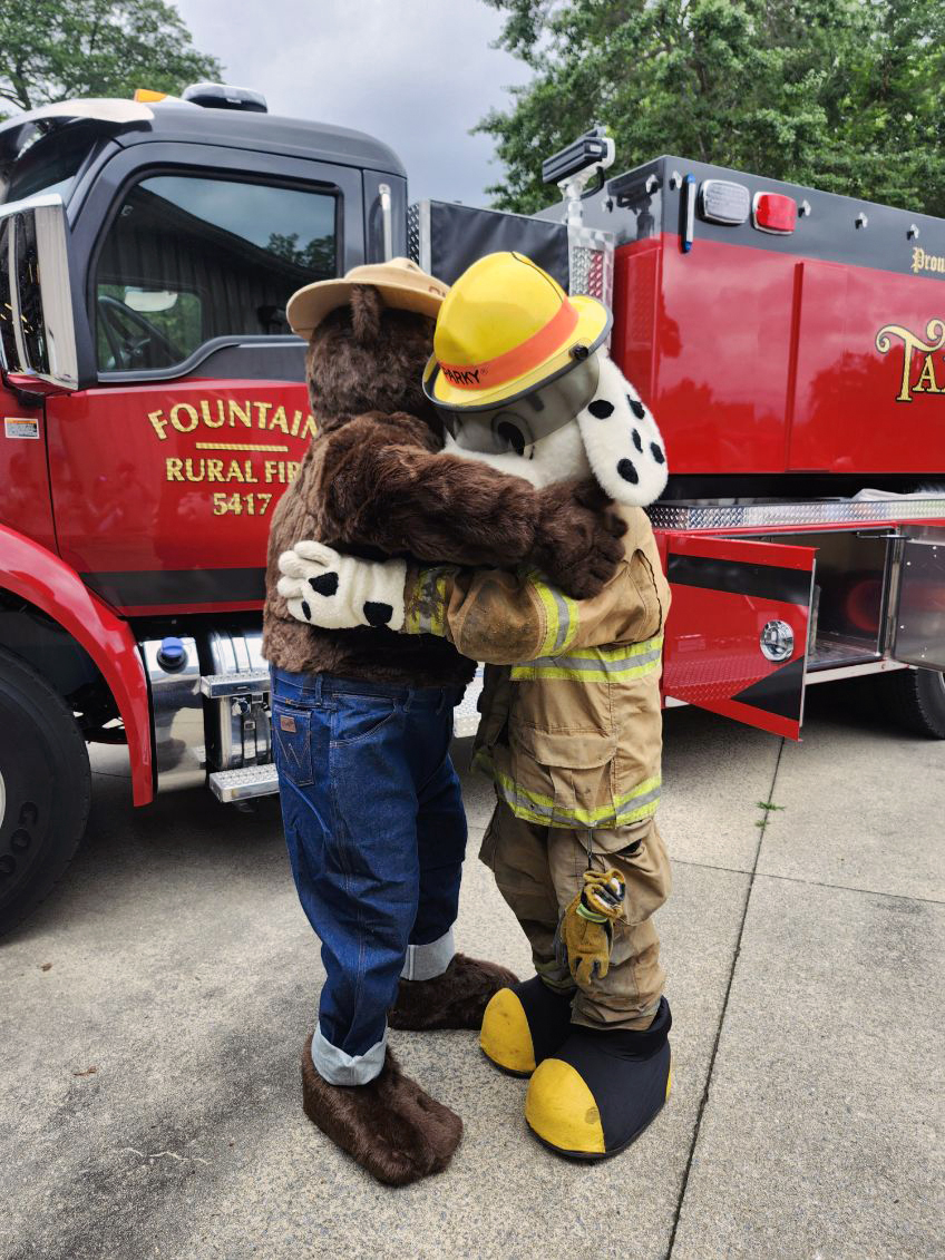 Recently, N.C. Forest Service Pitt County Ranger Robin Weber, accompanied by everyone’s favorite wildfire prevention bear, Smokey, visited Fountain Fire Dept. to show support and appreciation for a new 3,000-gallon pumper & rescue equipment hauler, & to spend time with Sparky!