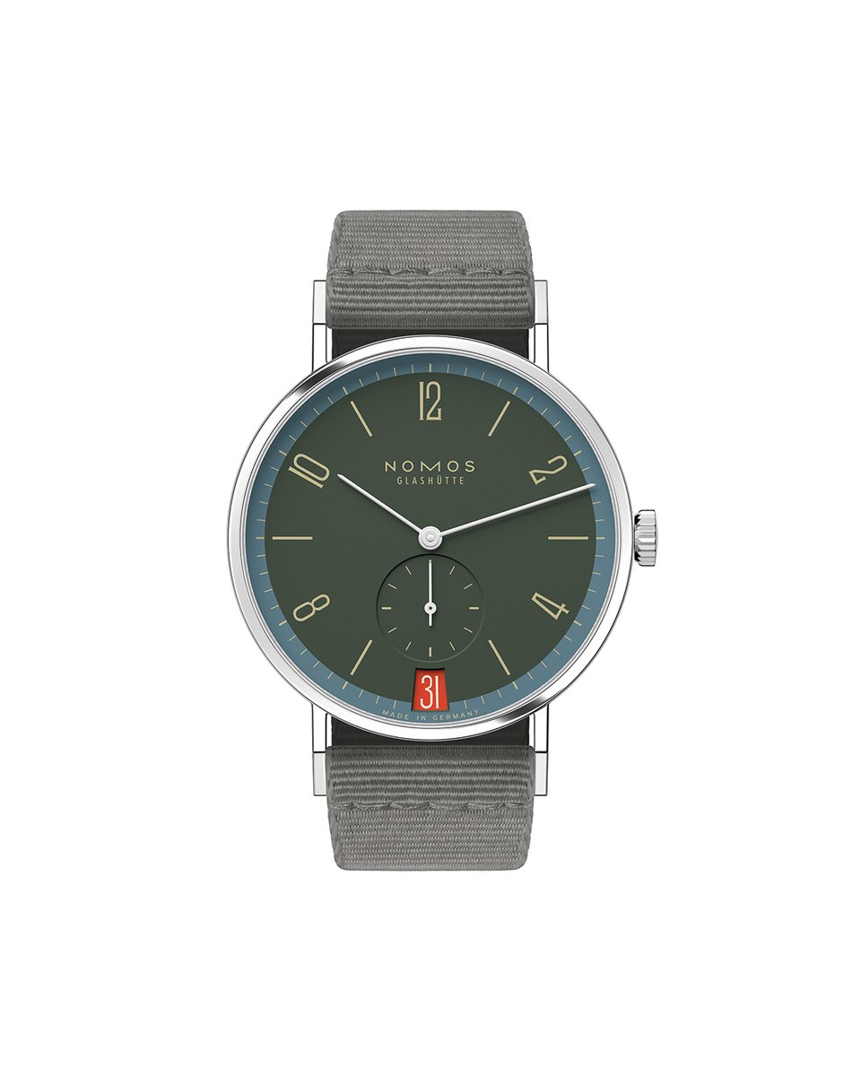 Another complex tone: the basic color of the dial is anthracite with dark green parts, the outer and minute rings are smoky blue, while the numerals and indexes, as well as the NOMOS logo, are cream-colored. #Tangente 38 date #Lakritze is available at selected #NOMOS retailers.