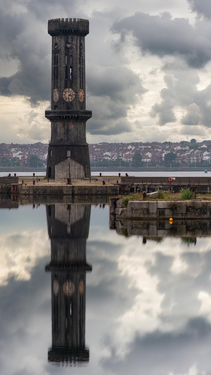 Salisbury Dock, #Liverpool and a moody sky over the six sided (and six clocks) granite Victoria Tower aka 'The Dockers' Clock.' Built in 1848 and designed by Albert Dock's Jesse Hartley.