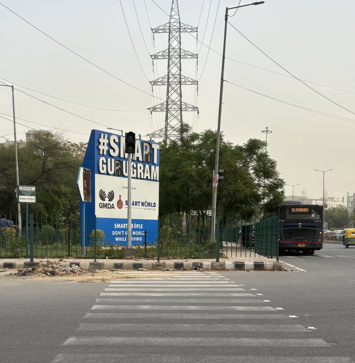 Zebra crossing leading to inaccessible, guardrail-ed footpaths at a junction with heavy vehicular traffic in “Smart” Gurgaon.

In a country that still heavily commutes with non-motorised modes of transport, we are so far from creating #streetsforall.