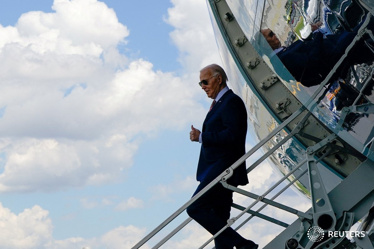 President Joe Biden gestures as he steps down from Air Force One upon his arrival at the Philadelphia International Airport in Philadelphia, Pennsylvania. Photo by @lizfrantz