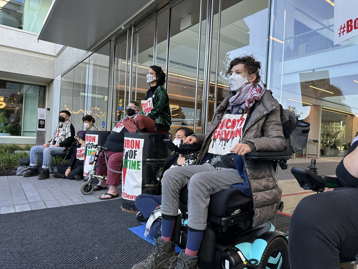 paulpaz's tweet photo. While @chevron CEO Mike Wirth was inside its annual meeting lying to shareholders about his company’s respect for human rights. This was happening outside. #BoycottChevron #EndChevron #CleanUpEcuador #ChevronAGM https://t.co/I4I9e8pqNW