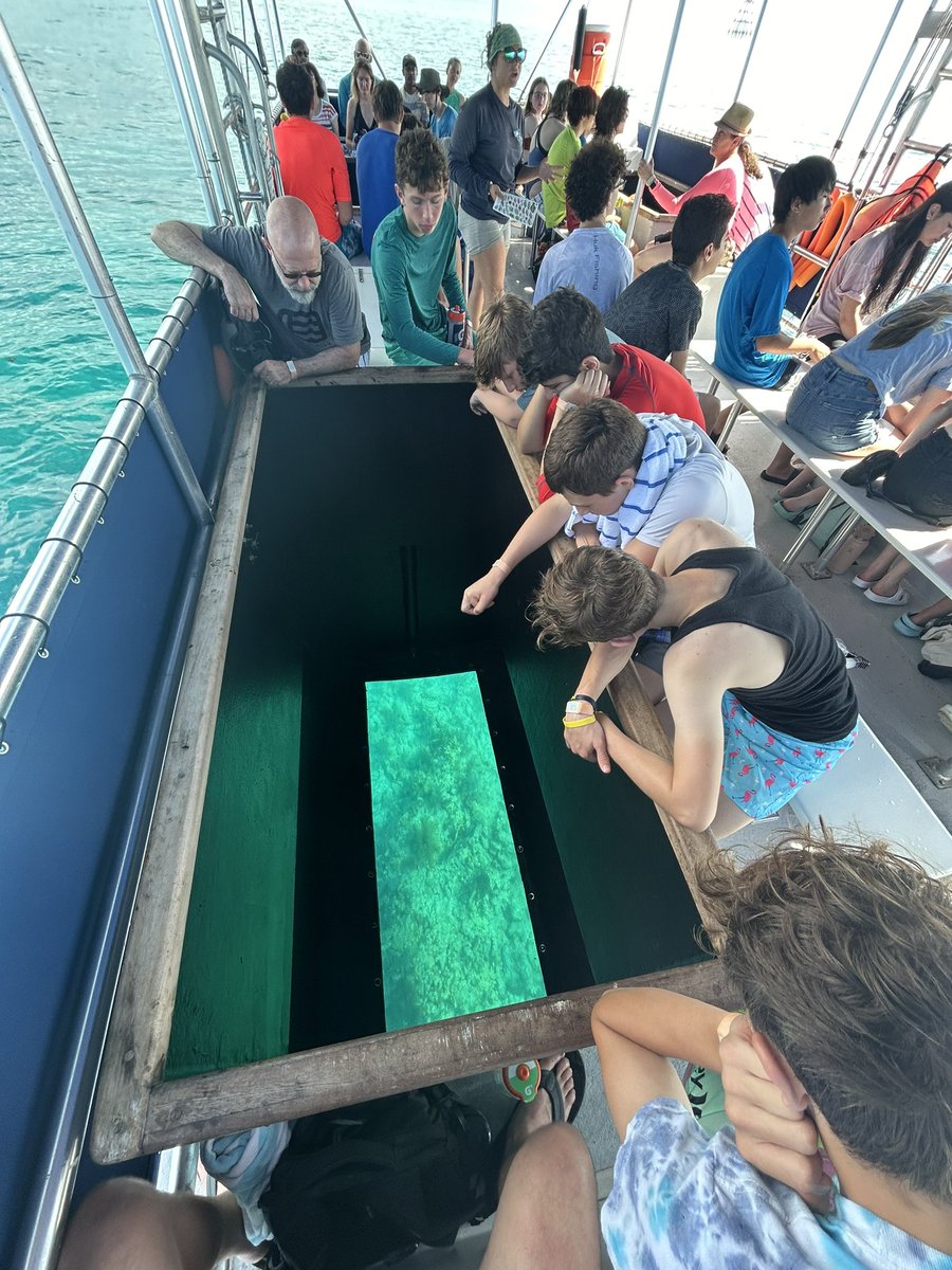 zimmera's tweet photo. Off on the glass bottom boat - learning about species on the reef and dodging thunderstorms. Very cool intro to what we’ll see later when we snorkel! https://t.co/fGW2KmsHKq