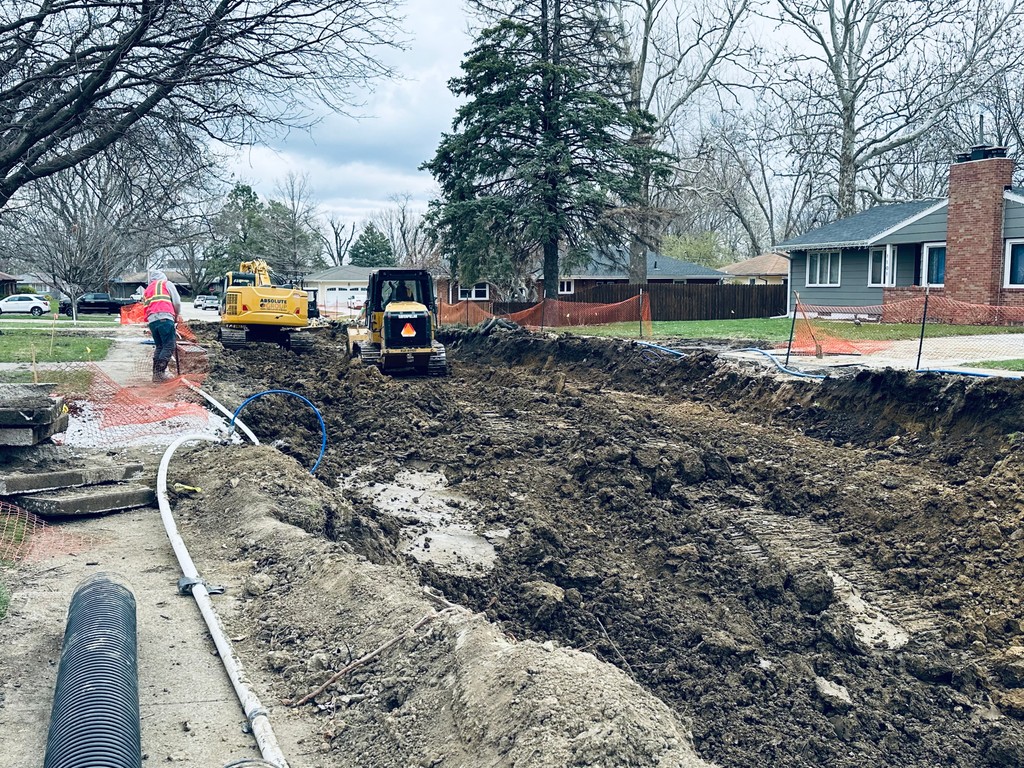 Action shots of Utility Foreman Josh and his crew installing sanitary sewer on a reconstruction project in Ankeny, IA.