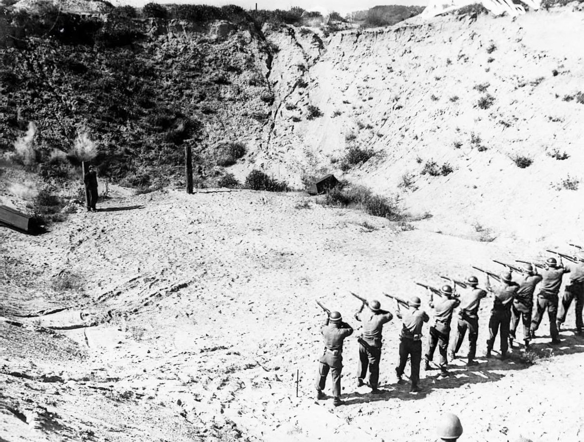 US Military police tie a member of the Hitler Youth to a stake. The 17 year old boy was executed by firing squad for spying on US troops😡