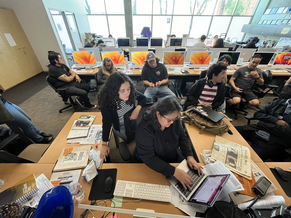 Members of The Union newspaper and Warrior Life magazine watch the final moments before the last Union issue of the semester is sent for printing. #eccunion
