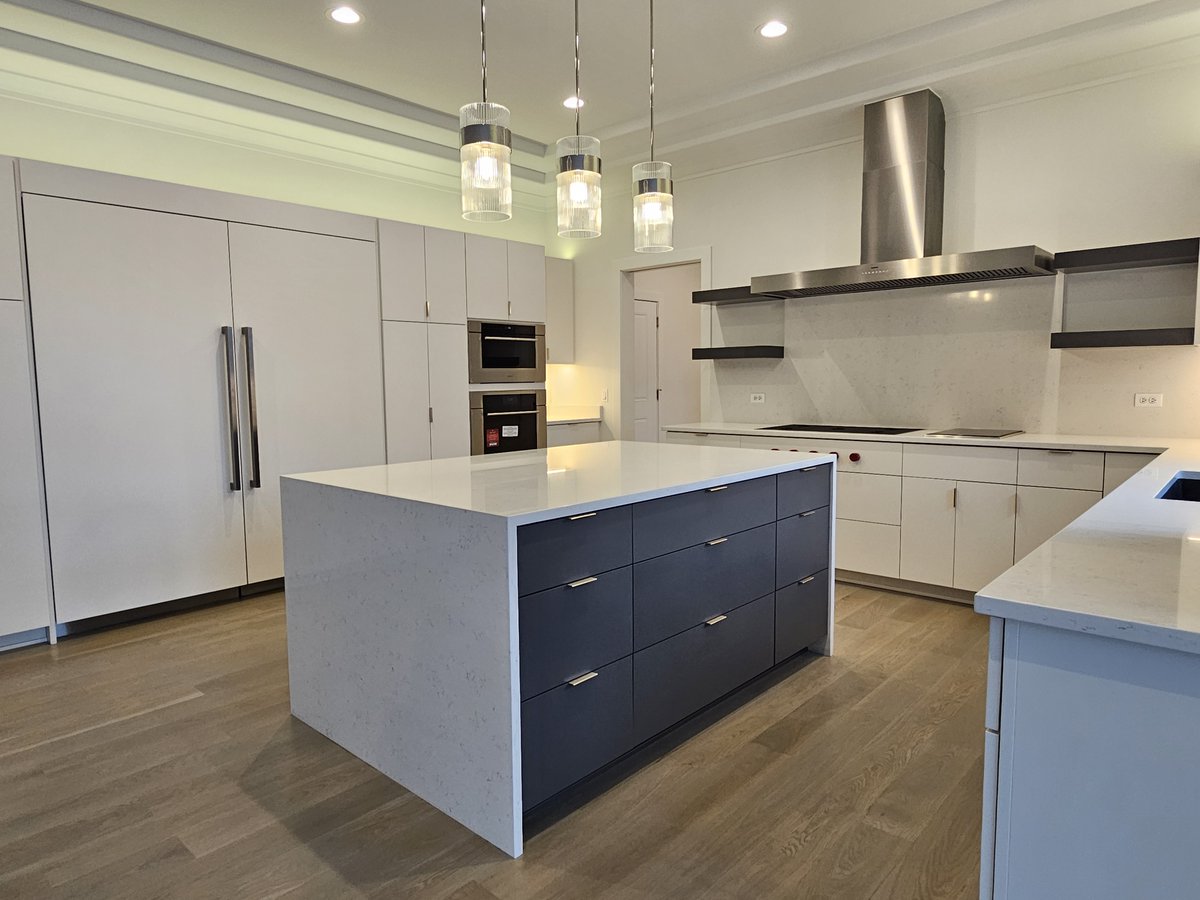 Very modern, sleek #kitchencabinets with #customdoors for the built-in #refrigerator/freezer. Our #modelhome is open from 11 am - 5 pm at 4012 Alfalfa Ln #Naperville #newhome #newhomedesign #newhomebuilder #newhomeconstruction #homebuilder #customhomebuilder #kitcheninspo