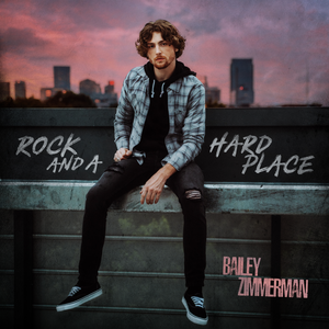 Now Playing: Rock And A Hard Place by @baileyzimmerman Listen Live at kickincountryonline.com