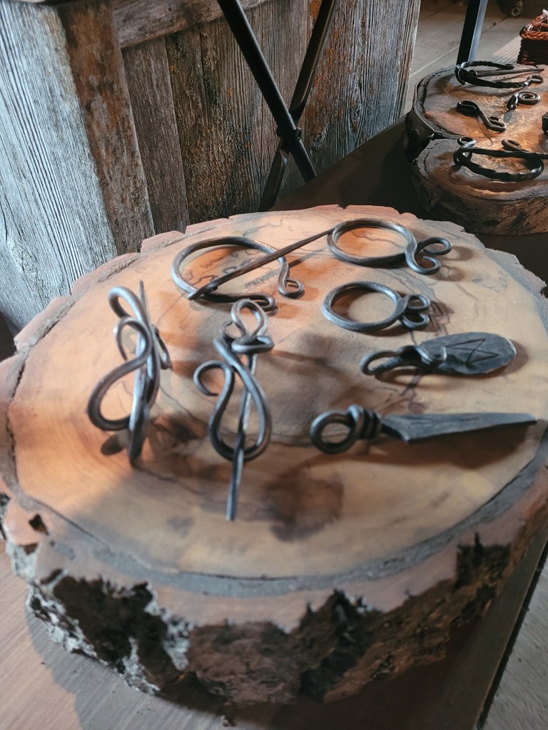 To help celebrate 30 years since the Lacombe Blacksmith Shop became a museum the blacksmiths have been tasked to express their creativity with new projects. Pictured are new pendants, penannular brooches, and hairpins in the giftshop.