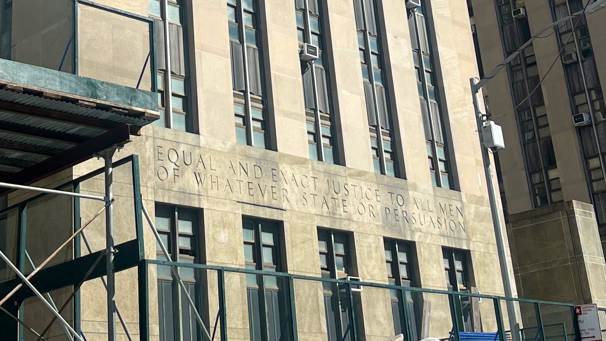 Above the entrance to the New York (Manhattan) Criminal Court is a quotation from Thomas Jefferson, from his first inaugural address: 

“EQUAL AND EXACT JUSTICE TO ALL MEN OF WHATEVER STATE OR PERSUASION.”