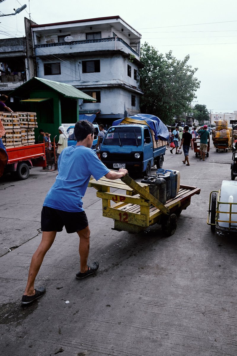 Pushing Through #streetphotography #streetphotographers #lensculturestreets #streetphotographer #thestreetphotographyhub #beststreets #documentaryphotography #documentaryphotographer #filmsimulation #kodachrome64 #Kodachrome #cebu #capturedmoments #streetphotographerscommunity