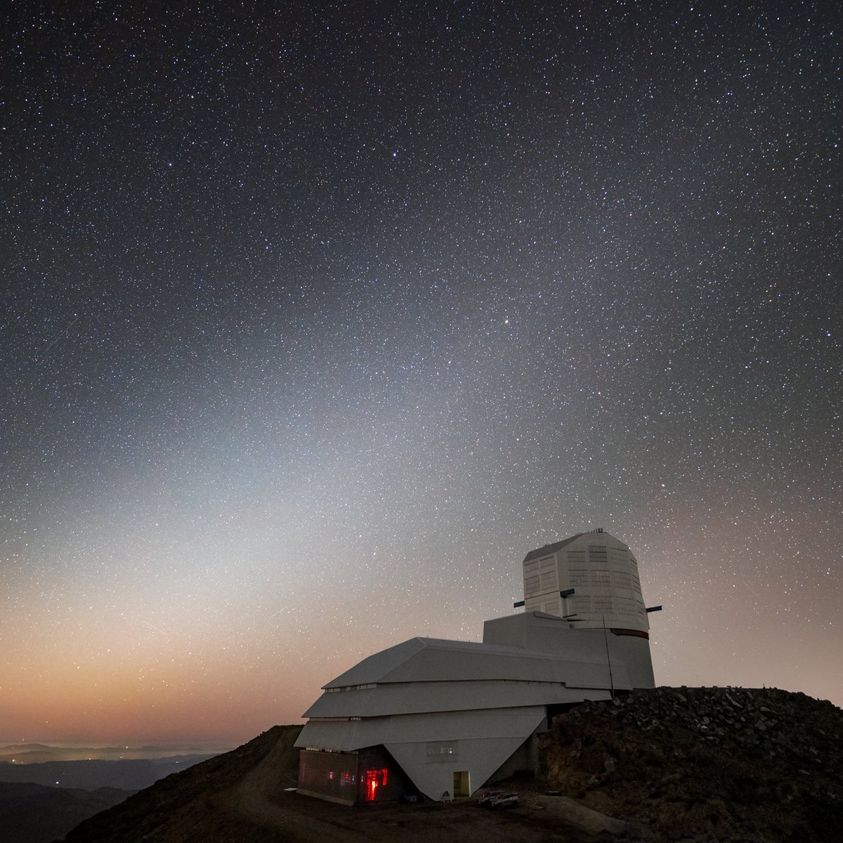 In this #imageoftheweek, @VRubinObs sits under the faint glow of a fascinating astronomical phenomenon known as zodiacal light. Rubin Observatory is being built on Cerro Pachón, Chile and is a Program of @NSF @NOIRLab, which, along with @DOE’s @SLACLab, will jointly operate Rubin