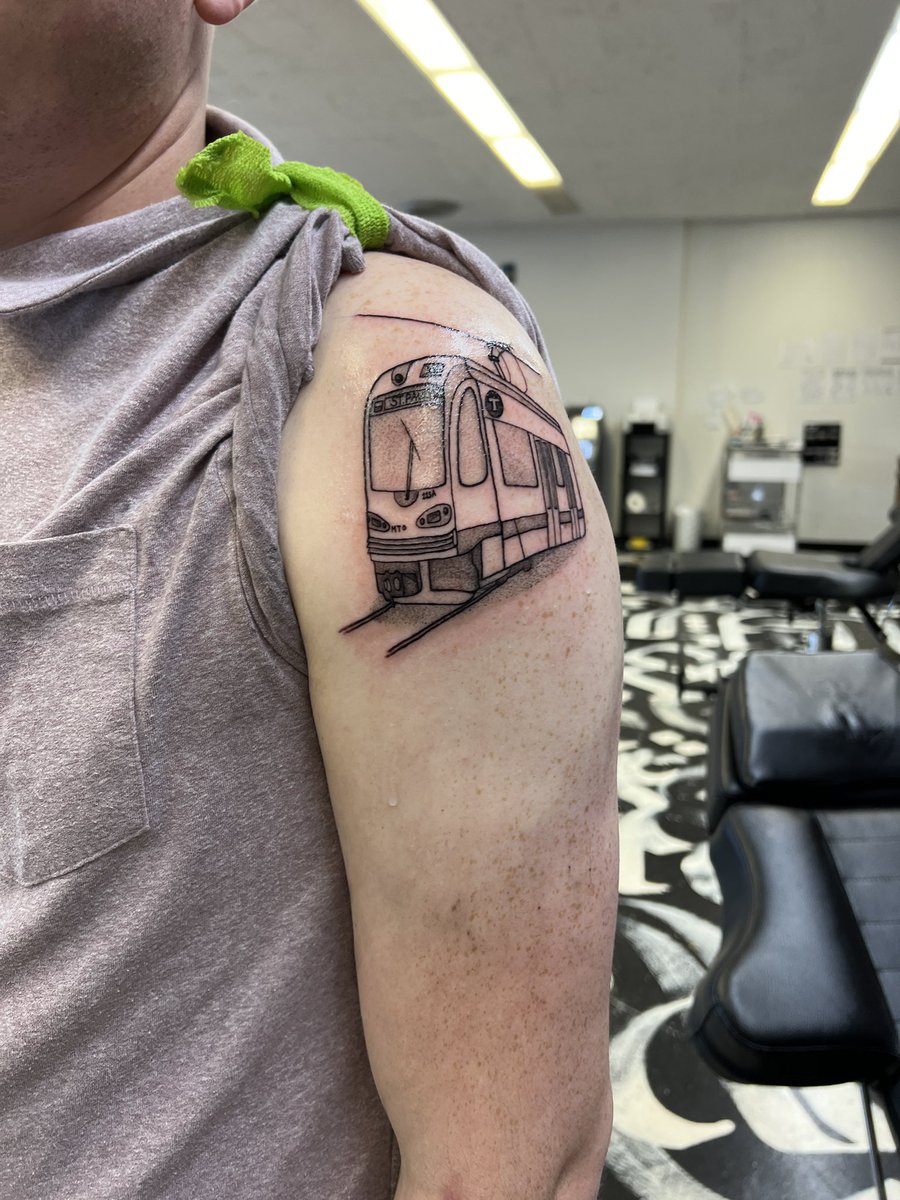 Hey <a href="/MetroTransitMN/">Metro Transit</a> just thought you wanna see my fiancé’s tattoo. He loves public transit so much he got a light rail tattooed on him 💕