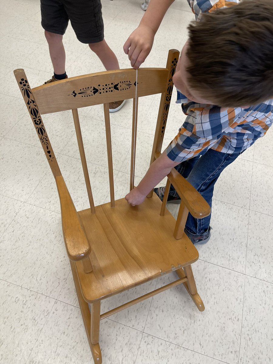 Hard at work in Grade 1, measuring objects found in class using a non standard unit of measurement.