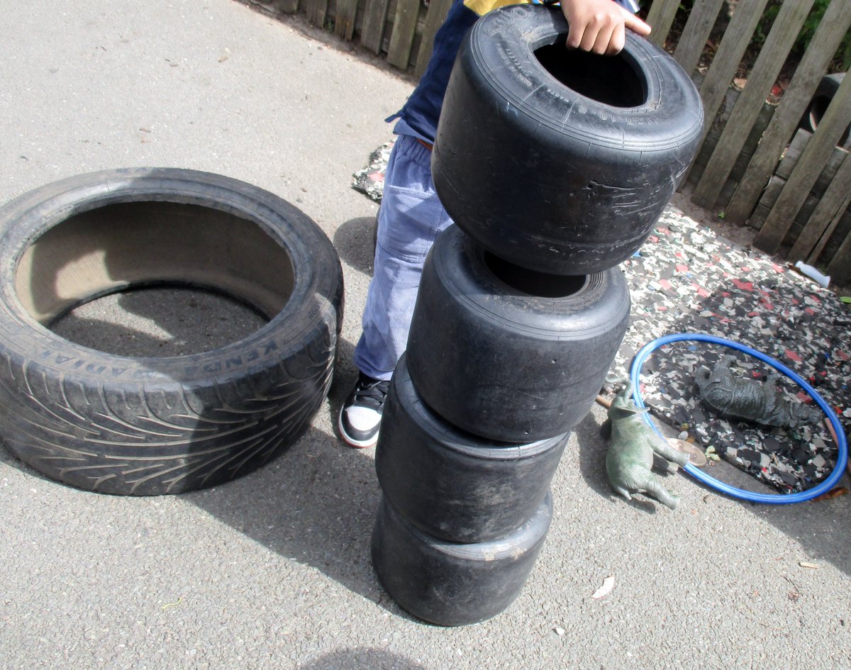 Mathematics being applied during play.
"I was tidying up."
"A tyre, I found another one!"
"Can you help me? Push."
"2 big yellow tyres, 2 blue and 1 black."
"1,2,3,4,5 small tyres."
"1,2,3,4,5. What? Again?"
"1,2,3,4,5,6,7."
"7 that's all!"
" Here there's 8. That's how much."
