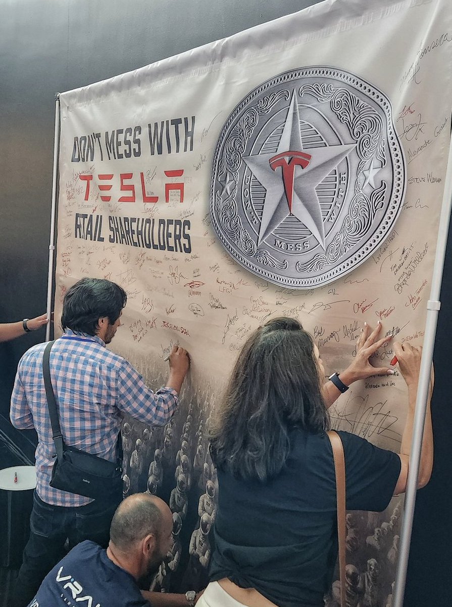 Tesla retail shareholders signing the "Don't mess with Tesla retail shareholders" sign at the event in Giga Texas today😎