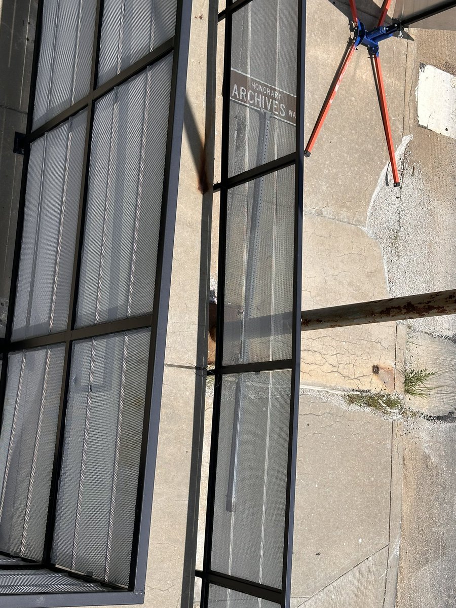 OhGreatScott's tweet photo. @KCMO311 Can you reopen this case? The street sign is still laying on the sidewalk… https://t.co/5cj6tpx05g